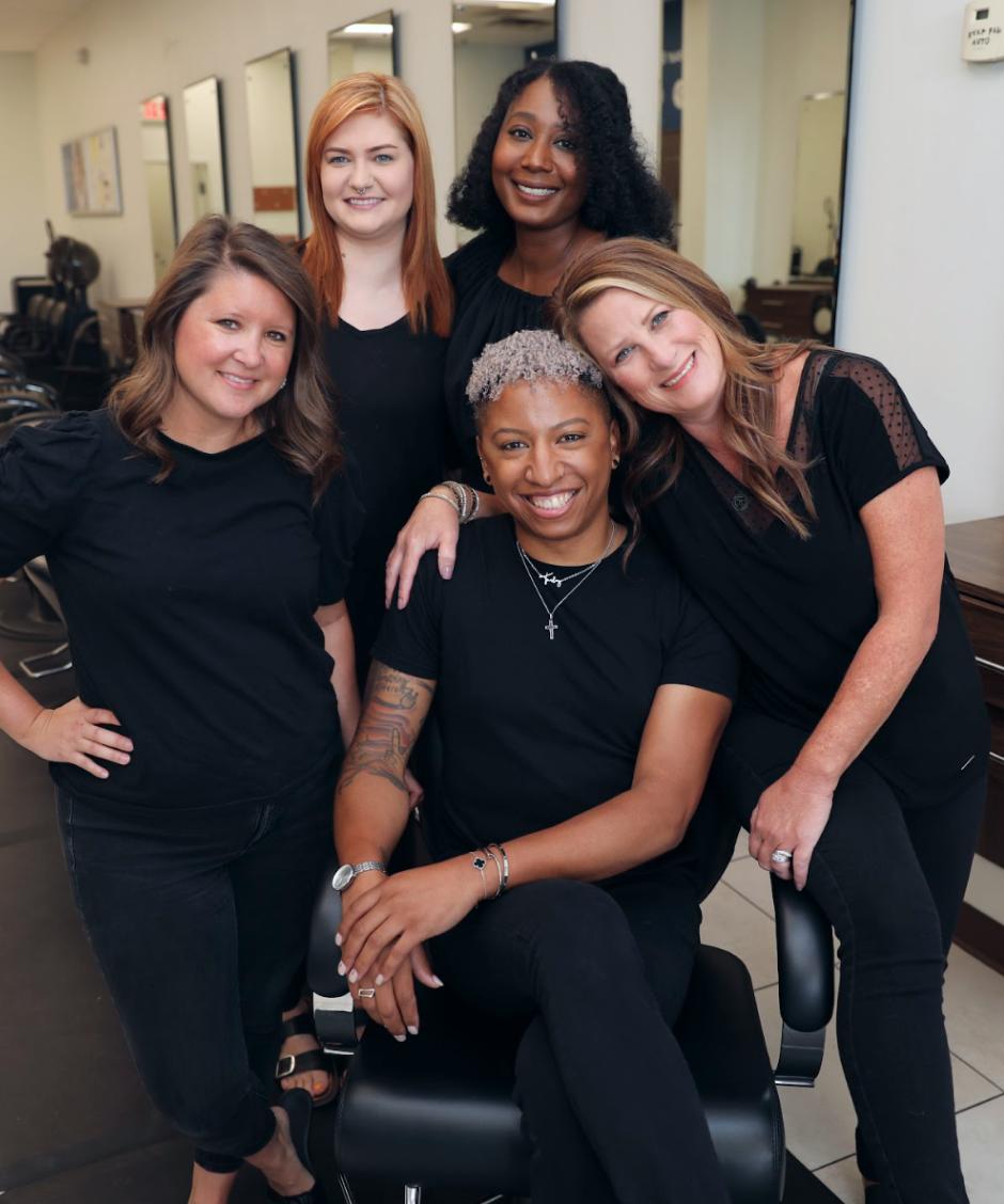 Group of stylists smiling together