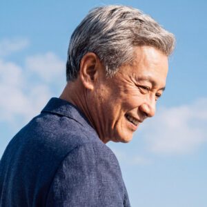 Senior aged Asian man with gray hair