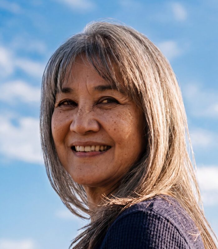 Senior-aged woman with shoulder length hair and bangs