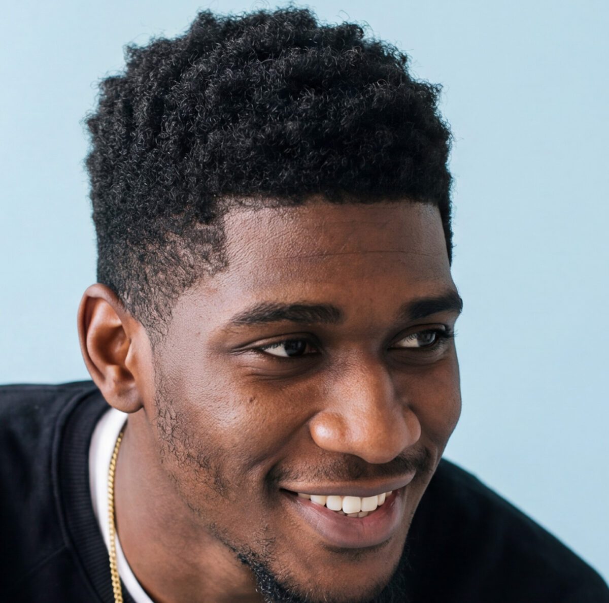 male with short edge-up style haircut