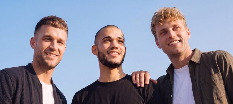 Three men with varied hairstyles