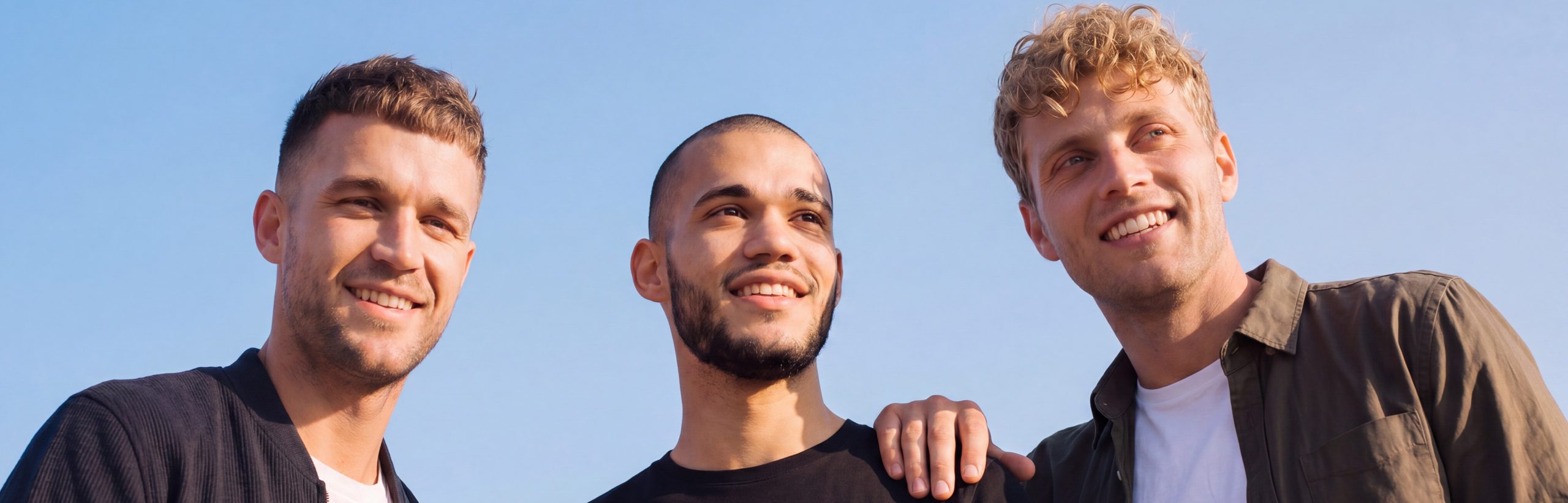 Three men with varied hairstyles